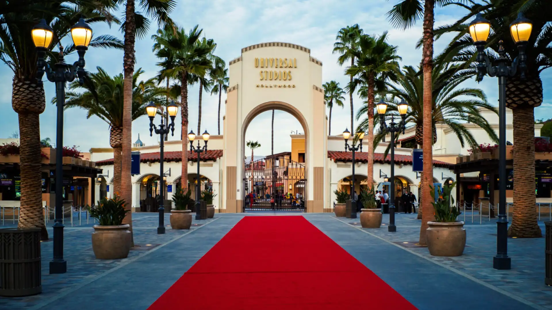 A red carpet is in front of the entrance to a movie theater.